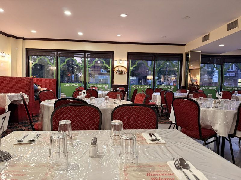 India Beau Village's reception hall — the “Party Hall · Salle de réception” decals visible on the windows